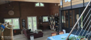 Suite parentale dans maison en bois Carcans - vue jardin